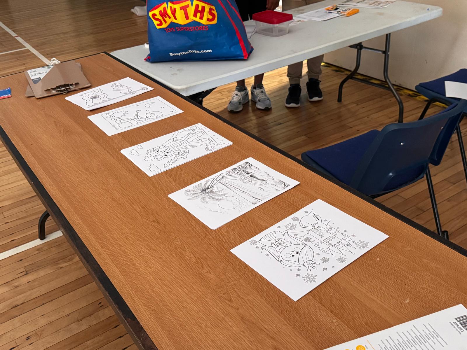 Colouring sheets laid out for the kids' activity table